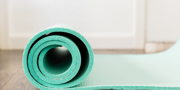 partially rolled up yoga mat