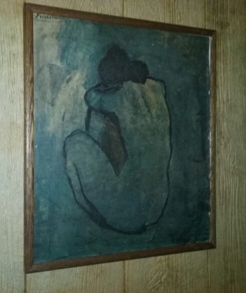 A print of a blue nude by Picasso.
