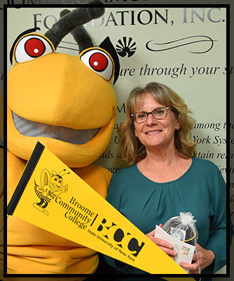 Susan Backo smiles with Stinger