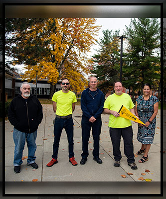 Four of the custodial services, grounds-keeping and maintenance team
