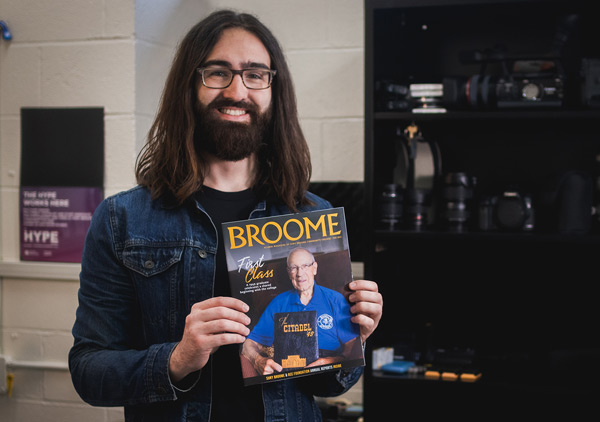 Matt holds up his first BROOME cover with a smile