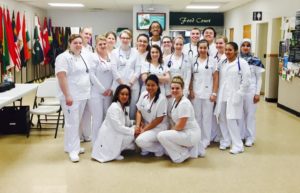 Medical Assisting Club posing together in white scrubs