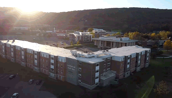 Download Zoom virtual background with various drone footage of the SUNY Broome campus (mp4)